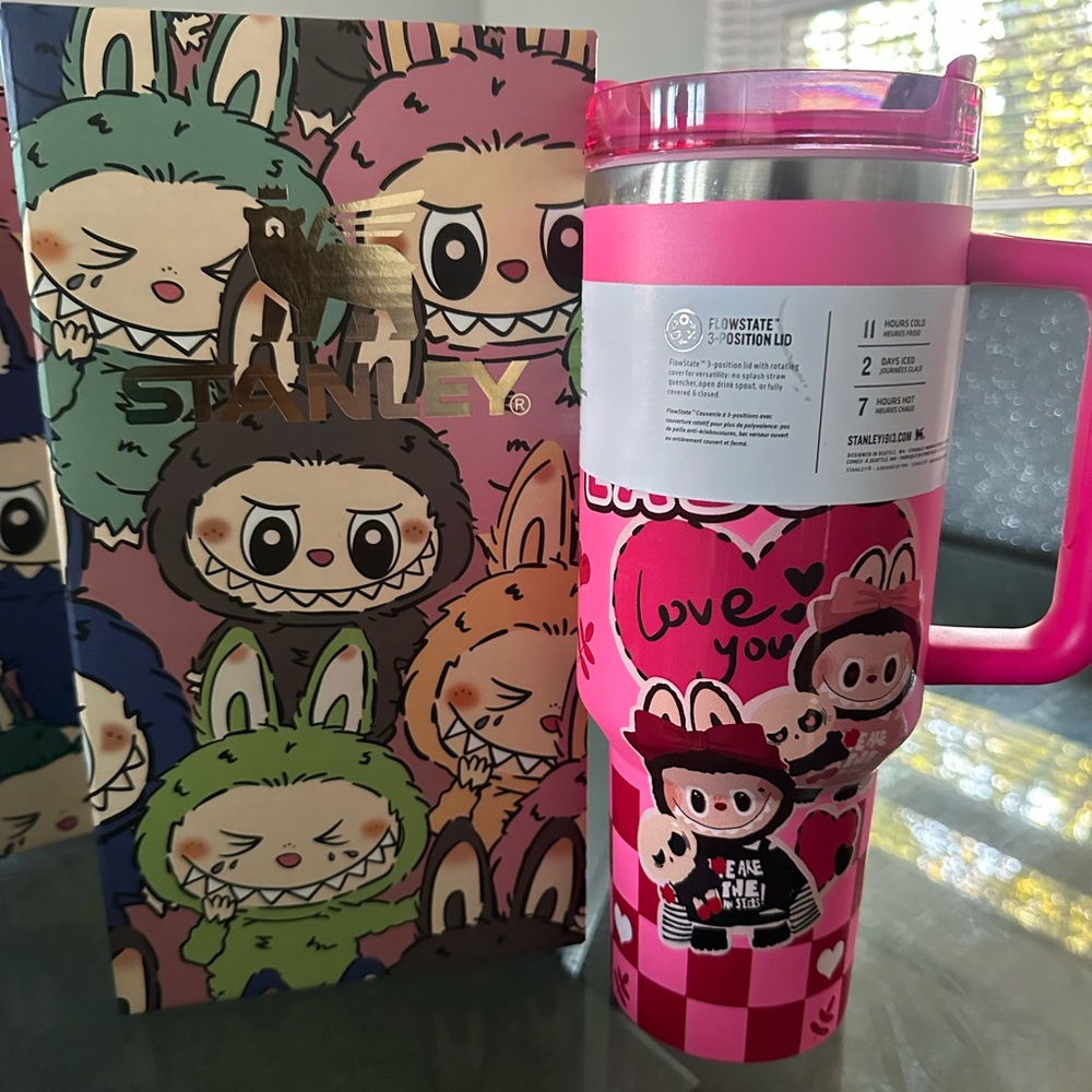 Stanley Pink and Silver Travel Mug with Fun Characters